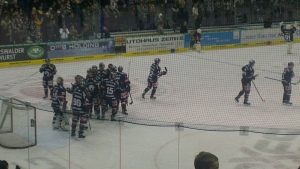 The hosts celebrate their important league win with netminder Sebastian Elwing (c) Banners On The World